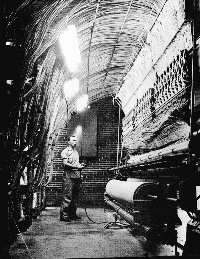 Photo of a Male worker working yarn tubes