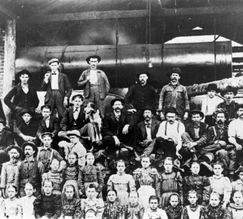 Photo of mill workers posing for group photo