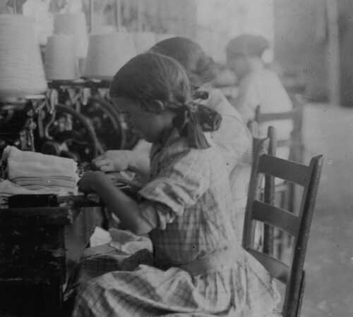 Photo of young Women working at mill machines