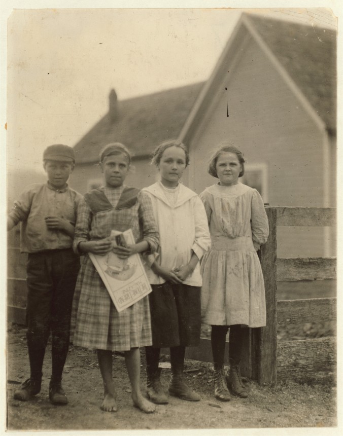 Photo of a group of young mill workers