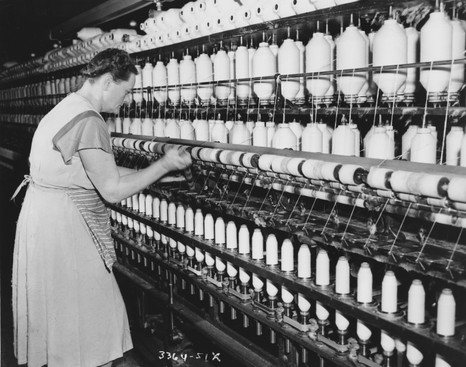 Photo of a woman re-spooling the rack